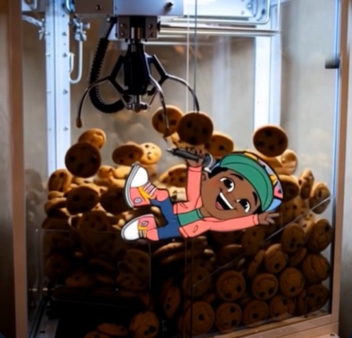 Jordy Monsta tumbling through a cookie claw machine full of cookies